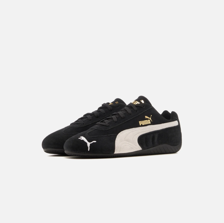 PUMA Black & White Low-Top Sneakers with Gold-Tone Branding
