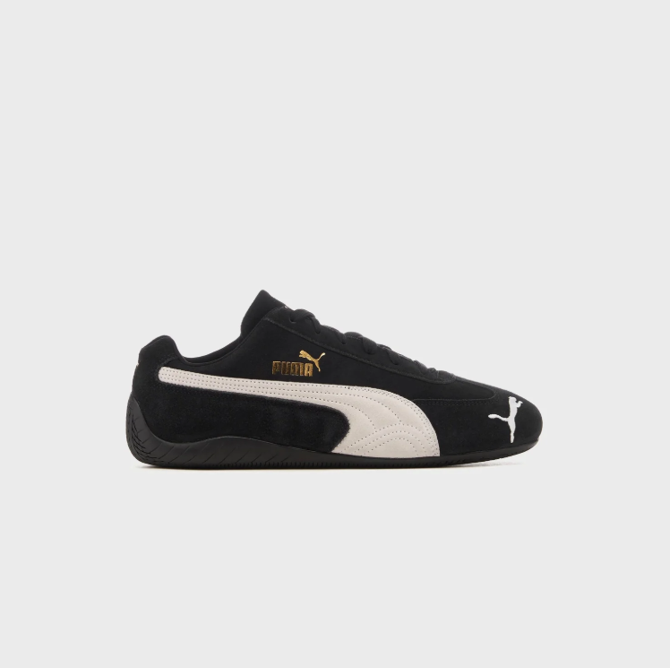 PUMA Black & White Low-Top Sneakers with Gold-Tone Branding