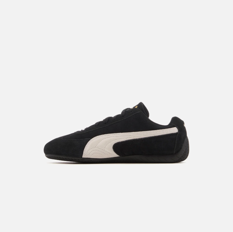 PUMA Black & White Low-Top Sneakers with Gold-Tone Branding