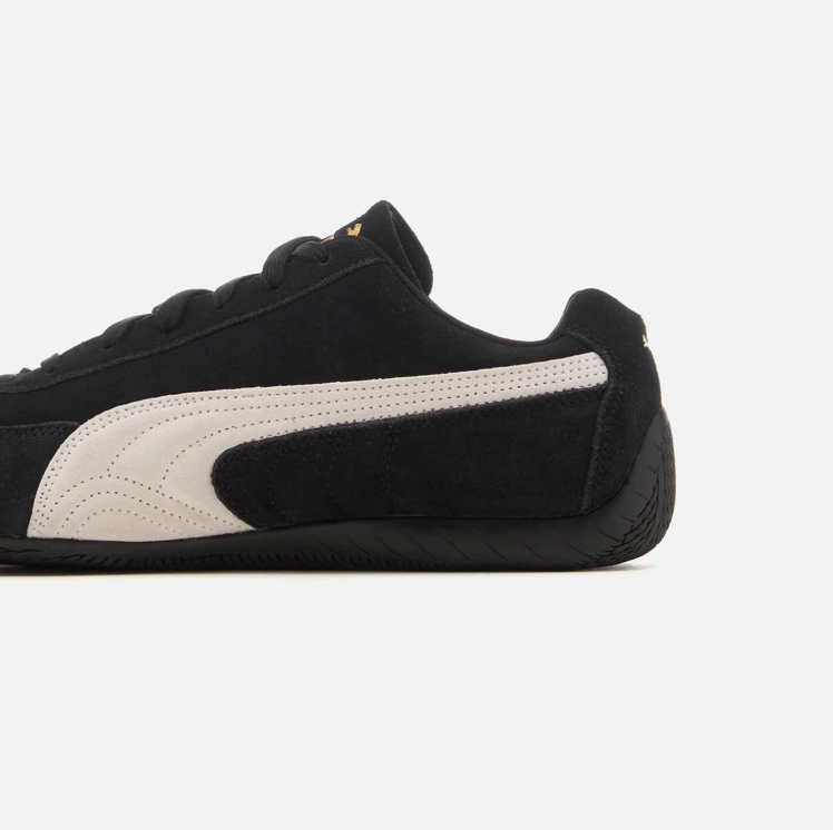 PUMA Black & White Low-Top Sneakers with Gold-Tone Branding