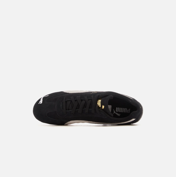 PUMA Black & White Low-Top Sneakers with Gold-Tone Branding
