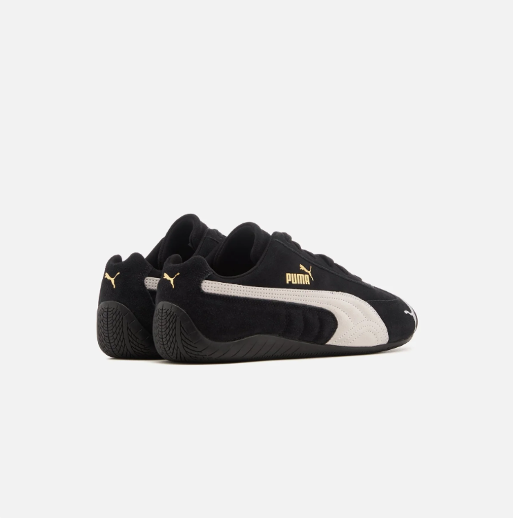 PUMA Black & White Low-Top Sneakers with Gold-Tone Branding